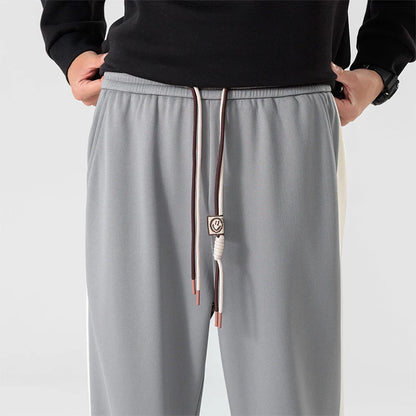 DRIFT STRIPED SWEATPANTS